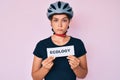 Beautiful caucasian woman wearing bike helmet holding ecology word depressed and worry for distress, crying angry and afraid