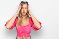 Beautiful caucasian woman wearing sunglasses and summer style suffering from headache desperate and stressed because pain and Royalty Free Stock Photo