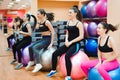 Beautiful caucasian women doing exercise with gymnastic ball