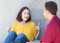 Beautiful caucasian young adult talking with latin friend Royalty Free Stock Photo