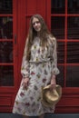 Beautiful caucasian young woman in dress standing on the street in London Royalty Free Stock Photo