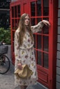 Beautiful caucasian young woman in dress standing on the street in London Royalty Free Stock Photo