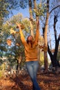 Beautiful caucasian young woman walking and having fun outdoors in autumn time. Royalty Free Stock Photo