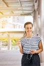 Beautiful caucasian young women using headphone and listening with dancing to music outdoor,Good attitude,Positive thinking Royalty Free Stock Photo