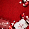 Christmas gifts presents on red background. Simple, classic red and white wrapped gift boxes with ribbon Royalty Free Stock Photo