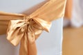 beautiful chairs decoration with ribbon in wedding event hall,selective focus. Royalty Free Stock Photo