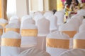 Beautiful chairs decoration with ribbon in wedding event hall,se Royalty Free Stock Photo