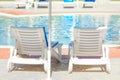 Beautiful chaise lounges by the pool on nature at sea background Royalty Free Stock Photo
