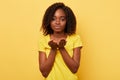 Beautiful charming african american woman blowing a kiss with hand on air