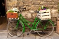 Beautiful charming street landscape with an old bike with flowers in drawers