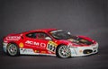 Beautiful charming view of Ferrari race sport miniature car model against dark grey background