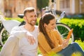 Beautiful charming woman with tablet and man laughing with closed eyes Royalty Free Stock Photo