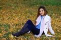 Beautiful charming young girl is flirting posing for the camera. smiling. Outdoor fashion portrait of stylish hipster cool girl. Royalty Free Stock Photo