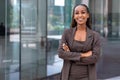 Beautiful cheerful african american executive business woman at the workspace office Royalty Free Stock Photo