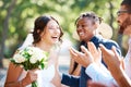 Beautiful cheerful bride greeting and socialising with friends and family. Guests congratulating the bride on her Royalty Free Stock Photo