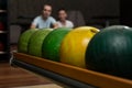 Beautiful Cheerful Couple Talking At The Bowling Alley Royalty Free Stock Photo