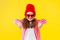 Colorful casual child girl isolated on yellow background Royalty Free Stock Photo