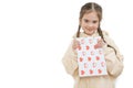 Beautiful cheerful young girl with colored shopping bag in hands over white background, copyspace for your text Royalty Free Stock Photo