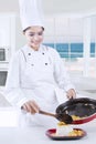 Beautiful Chef Cooking in The Kitchen Royalty Free Stock Photo