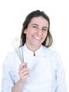 Beautiful chef cute brunette woman in cook uniform with hand beater over white background