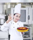 Chef holding delicious cake at work Royalty Free Stock Photo