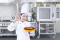 Chef holds delicious cake - horizontal Royalty Free Stock Photo