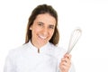 Beautiful chef restaurant cute brunette woman in cook uniform with hand beater over white background