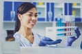 Beautiful chemist feeling joyful while working Royalty Free Stock Photo