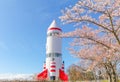 Beautiful cherry blossom , sakura in spring time and Rocket-shaped symbol tower with blue sky background in Inariyama park Naga Royalty Free Stock Photo