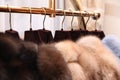 Chic expensive fur coats with natural fur on the hanger