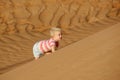 Child climbing sand dune Royalty Free Stock Photo