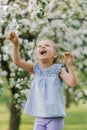 Beautiful child with dandelion flower. Happy kid having fun outdoors in spring park Royalty Free Stock Photo