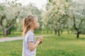 Beautiful child with dandelion flower. Happy kid having fun outdoors in spring park Royalty Free Stock Photo