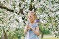 Beautiful child with dandelion flower. Happy kid having fun outdoors in spring park Royalty Free Stock Photo