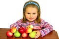 The beautiful child eats beautiful apples