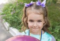 Beautiful child girl. She has a mischievous eyes and smile and has nice scrunchy Royalty Free Stock Photo