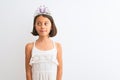 Beautiful child girl wearing princess crown standing over isolated white background smiling looking to the side and staring away Royalty Free Stock Photo