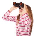 Beautiful child looks through the binoculars