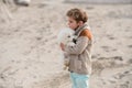 Boy with puppy play on the beach