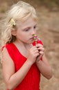 Beautiful child smelling flower Royalty Free Stock Photo