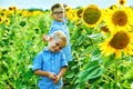 Beautiful children in the field with sunflowers Royalty Free Stock Photo