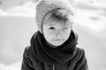 Beautiful children portrait. Winter. Snow. Cute boy in a hat and scarf. Royalty Free Stock Photo