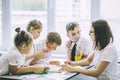 Beautiful children are students together in a classroom in school get the education with the teacher Royalty Free Stock Photo