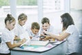 Beautiful children are students together in a classroom in school get the education with the teacher Royalty Free Stock Photo