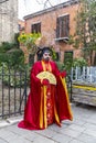 Beautiful Chinese emperor mask parading for the Venice Carnival in Campo San Zaccaria