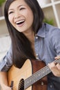 Beautiful Chinese Oriental Woman Smiling & Guitar