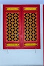 Beautiful Chinese style wooden red doors and windows with dragon Royalty Free Stock Photo