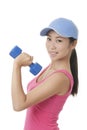 Asian teenager working out using dumbbell weights isolated on white background Royalty Free Stock Photo