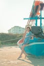 Beautiful Chinese woman standing on a fishing boat side on a Thailand island beach Royalty Free Stock Photo