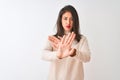 Beautiful chinese woman wearing turtleneck sweater standing over isolated white background Rejection expression crossing arms and Royalty Free Stock Photo
